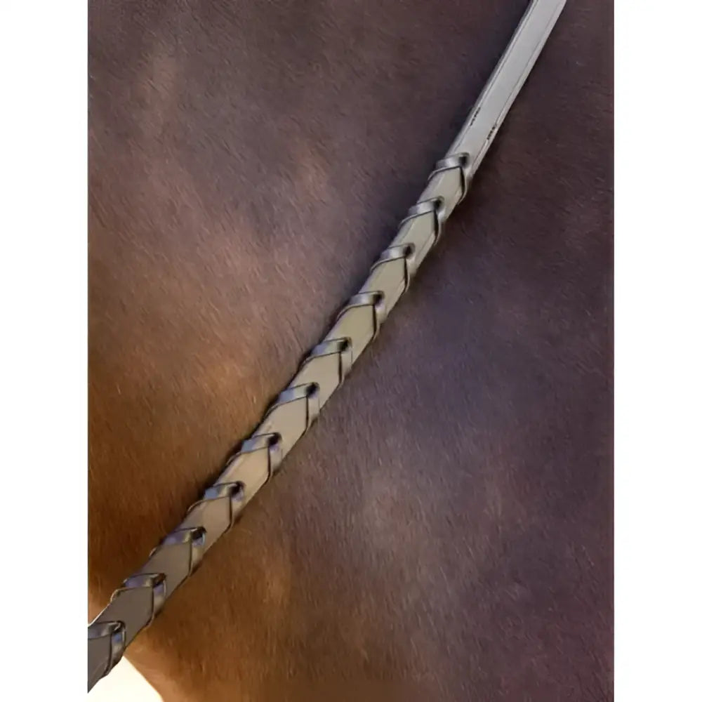 A sleek silver lemieux leather laced rein with braided leather and precise stitching for classic leather reins use