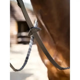 Silver-toned metal buckle on dark brown leather strap of lemieux leather laced classic leather reins