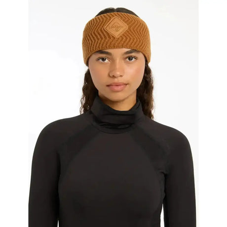 A tan ribbed knit lemieux lila headband ginger with a diamond leather patch featuring the brand name