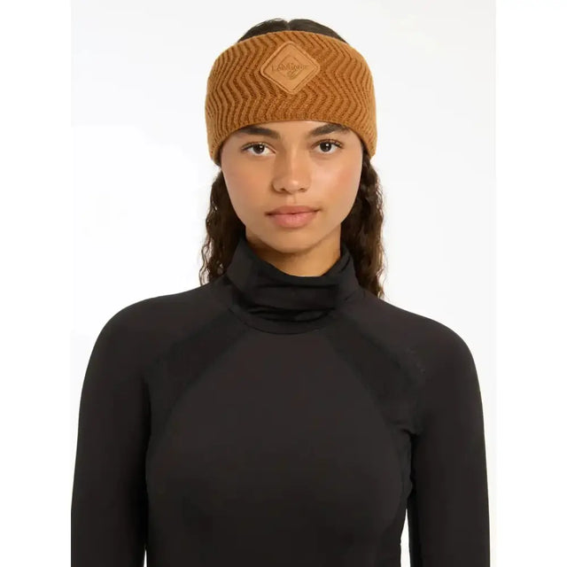 A tan ribbed knit lemieux lila headband ginger with a diamond leather patch featuring the brand name