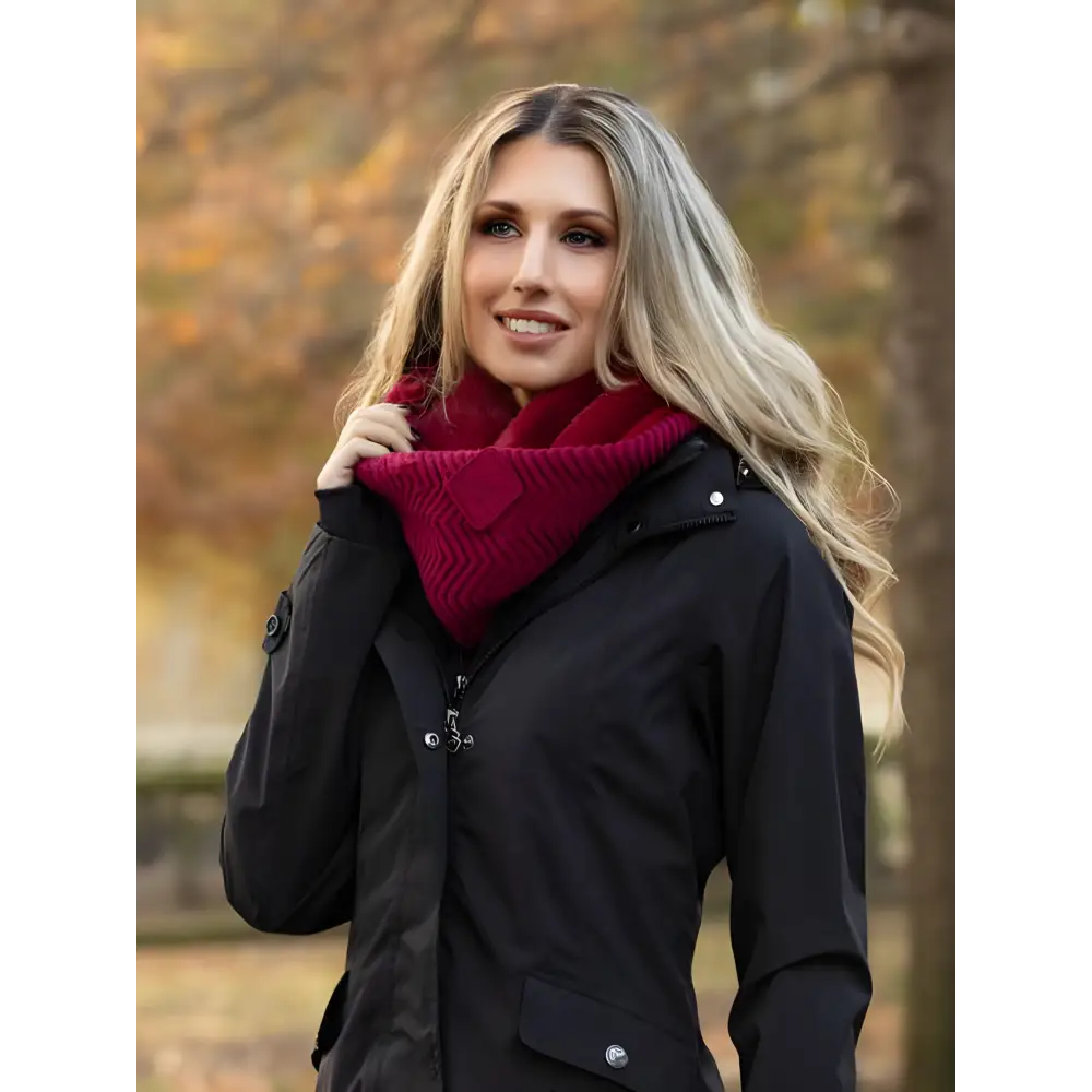 Woman in black coat and red scarf showcasing Lemieux Lila Snood Ember