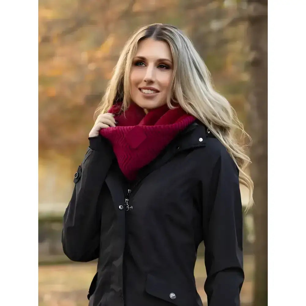 A plush deep red lemieux lila snood ember scarf with a cozy chevron knit pattern worn around the neck