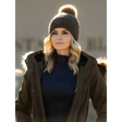 Woman in dark coat and knit Lemieux LM Beanie Alpine with faux fur pom-pom