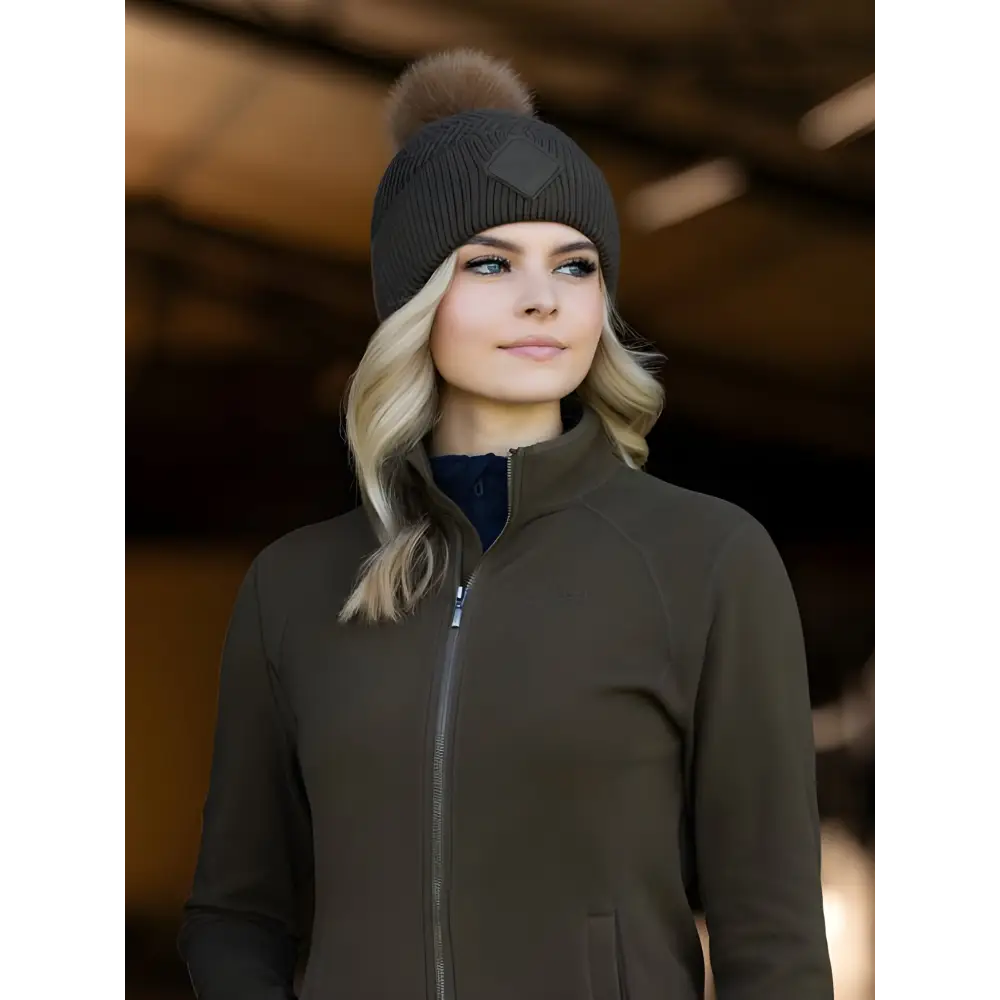 Woman in dark jacket and gray beanie featuring Lemieux LM Beanie Alpine faux fur