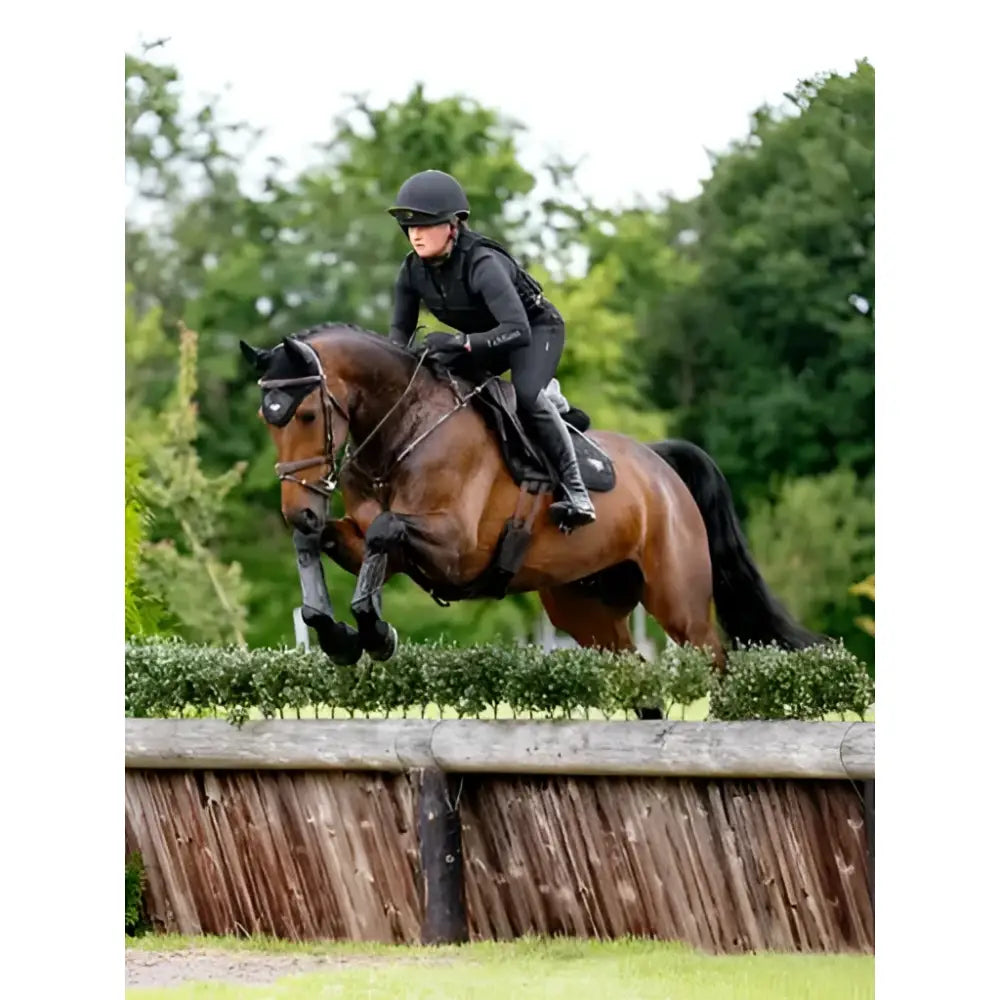 A sleek black lemieux loire classic riding helmet designed for classic close contact equestrian use