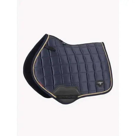 Navy blue quilted lemieux loire classic saddle pad with black edges beige trim and lohmann logo for classic close contact use