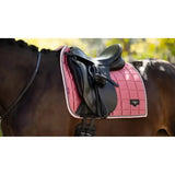 Pink quilted lemieux loire classic dressage square peony saddle pad with white trim and black brand logo