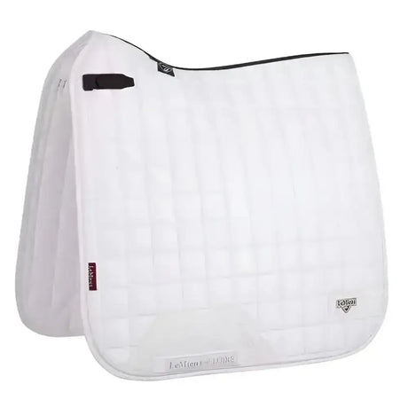 White quilted lemieux loire classic dressage square white saddle pad with black trim and brand logos