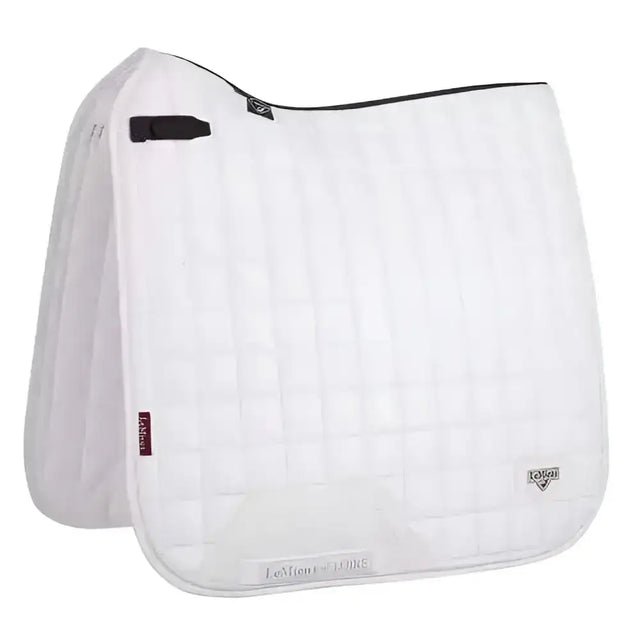 White quilted lemieux loire classic dressage square white saddle pad with black trim and brand logos