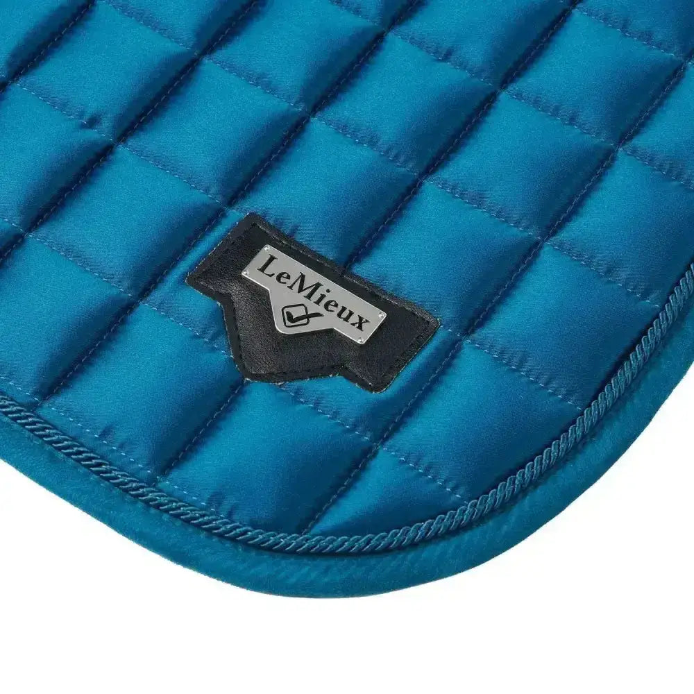 Bright blue lemieux loire classic satin dressage square with quilted design and black leather logo patch marine color