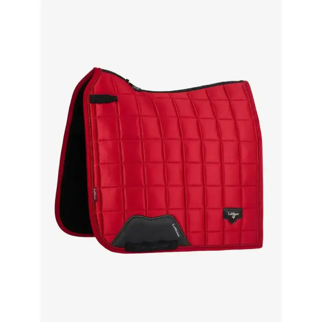 Red quilted lemieux loire dressage square chilli saddle pad with black trim and branded logo patch, stylish dressage pad