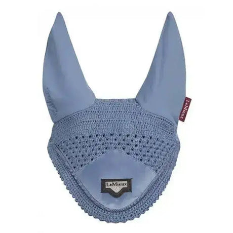 Light blue crocheted lemieux loire fly earring cover with smooth fabric lining and embroidered brand tag