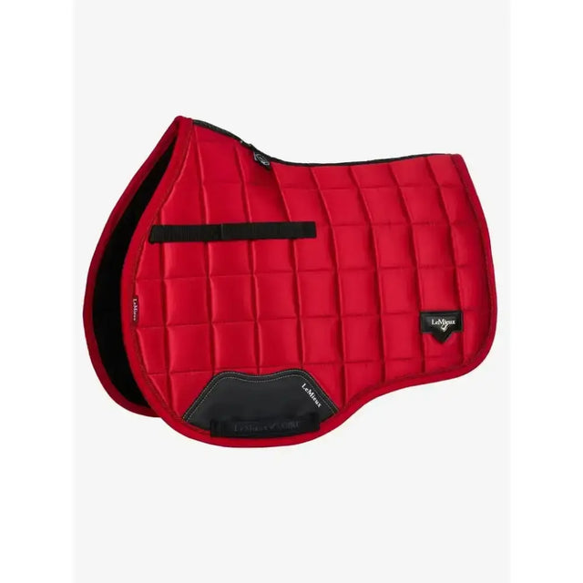 Red quilted saddle pad from le mieux loire range in woven satin fabric with black trim and branding for gp use
