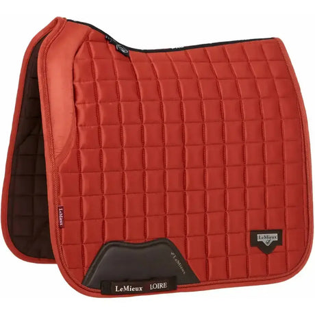 Red quilted lemieux loire memory satin dressage square saddle pad with black accents and lemieux logo in sienna