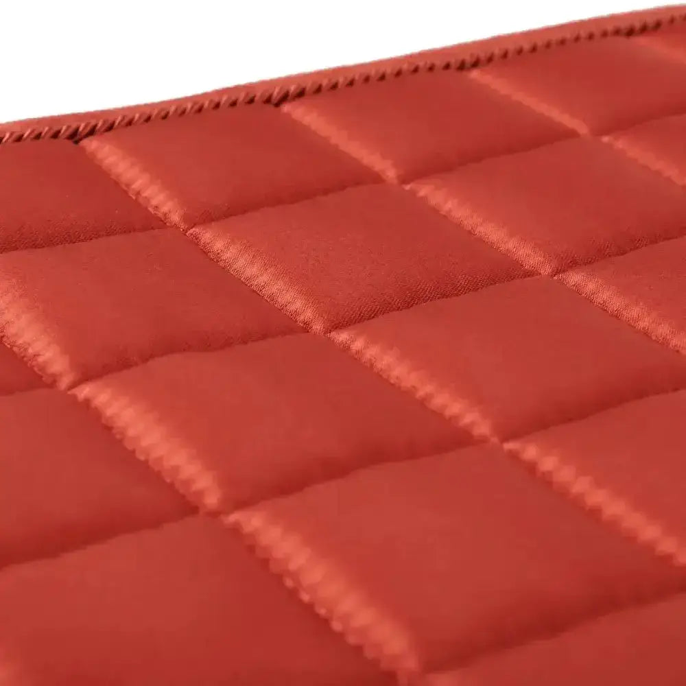 Red quilted lemieux loire memory satin dressage square in sienna with diamond pattern and neat edge stitching