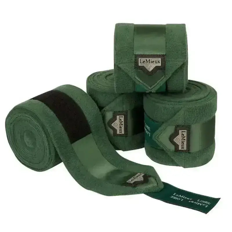 Dark green suede lemieux loire polo bandages with black elastic bands and branded leather tags in hunter green