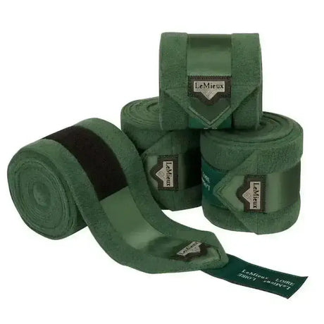 Dark green suede lemieux loire polo bandages with black elastic bands and branded leather tags in hunter green