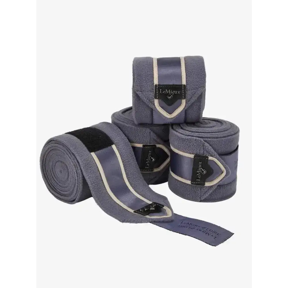 Gray plush lemieux loire polo wrap with white trim and black lemieux label in jay blue embossed metal motif style