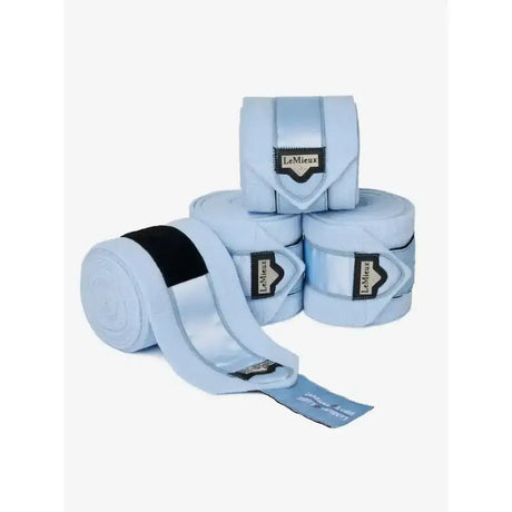 Light blue lemieux loire polo bandages with black elastic bands and branded labels for exercise bandages use