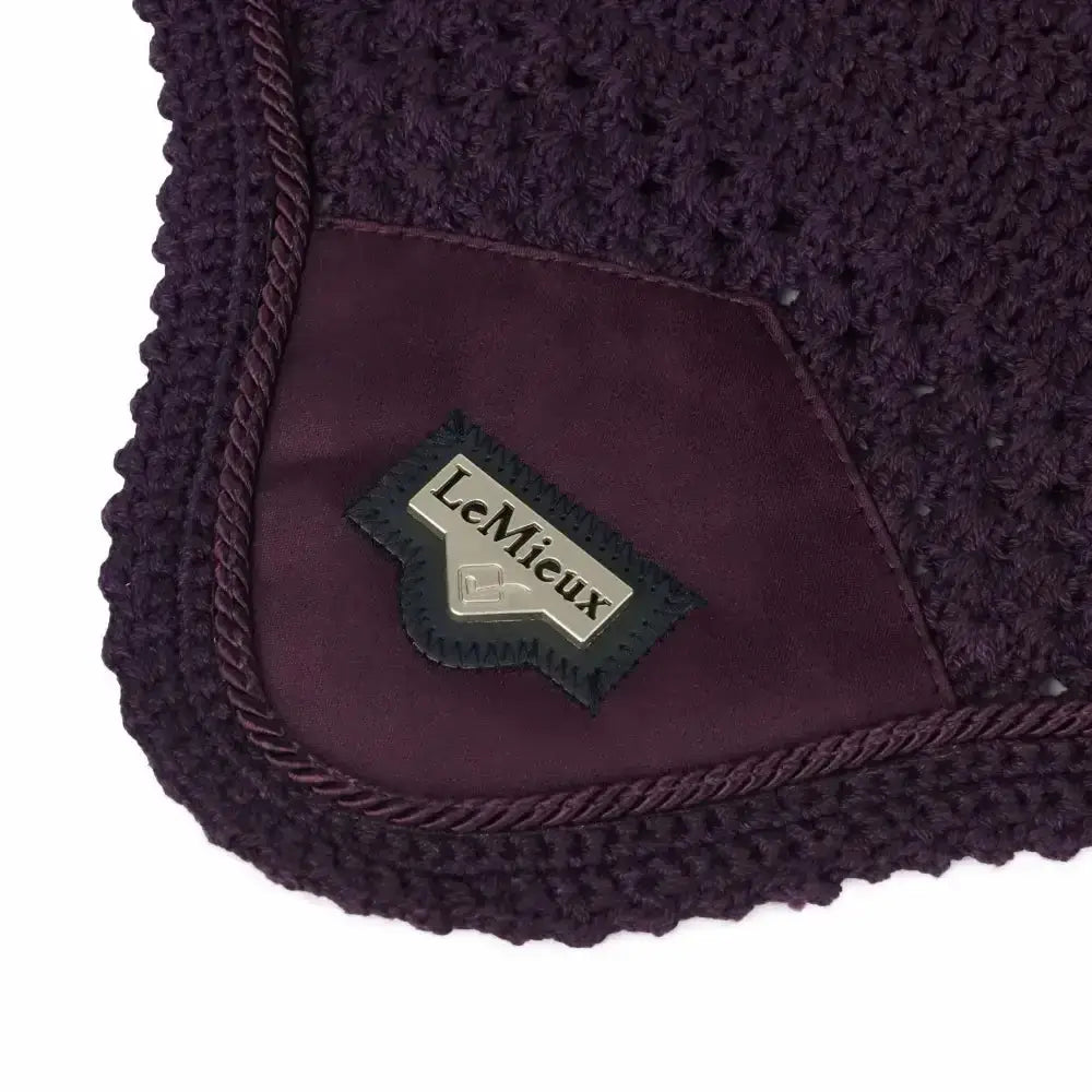 Dark purple crocheted horse pad with suede patch and embroidered lemieux loire satin brand label perfect for loire satin fly hood use
