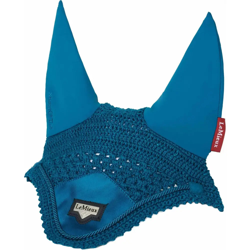 Teal crocheted horse ear bonnet with solid fabric ears and branded tag featuring signature lemieux loire satin design