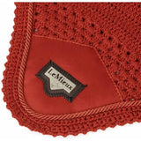Red crocheted lemieux loire satin horse pad with suede patch and braided trim featuring signature lemieux loire label