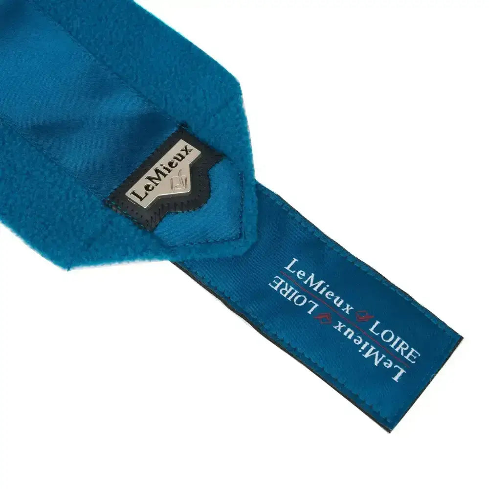 Blue fleece neck warmer with black and silver lemieux loire satin tag from loire satin polo bandages set