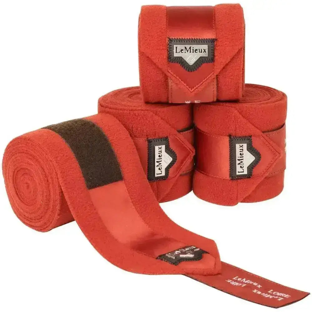 Bright red lemieux loire satin polo bandages set of 4 with black velcro straps and branded labels for horses