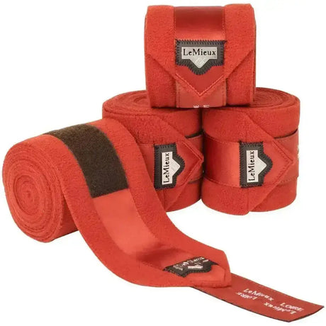 Bright red lemieux loire satin polo bandages set of 4 with black velcro straps and branded labels for horses