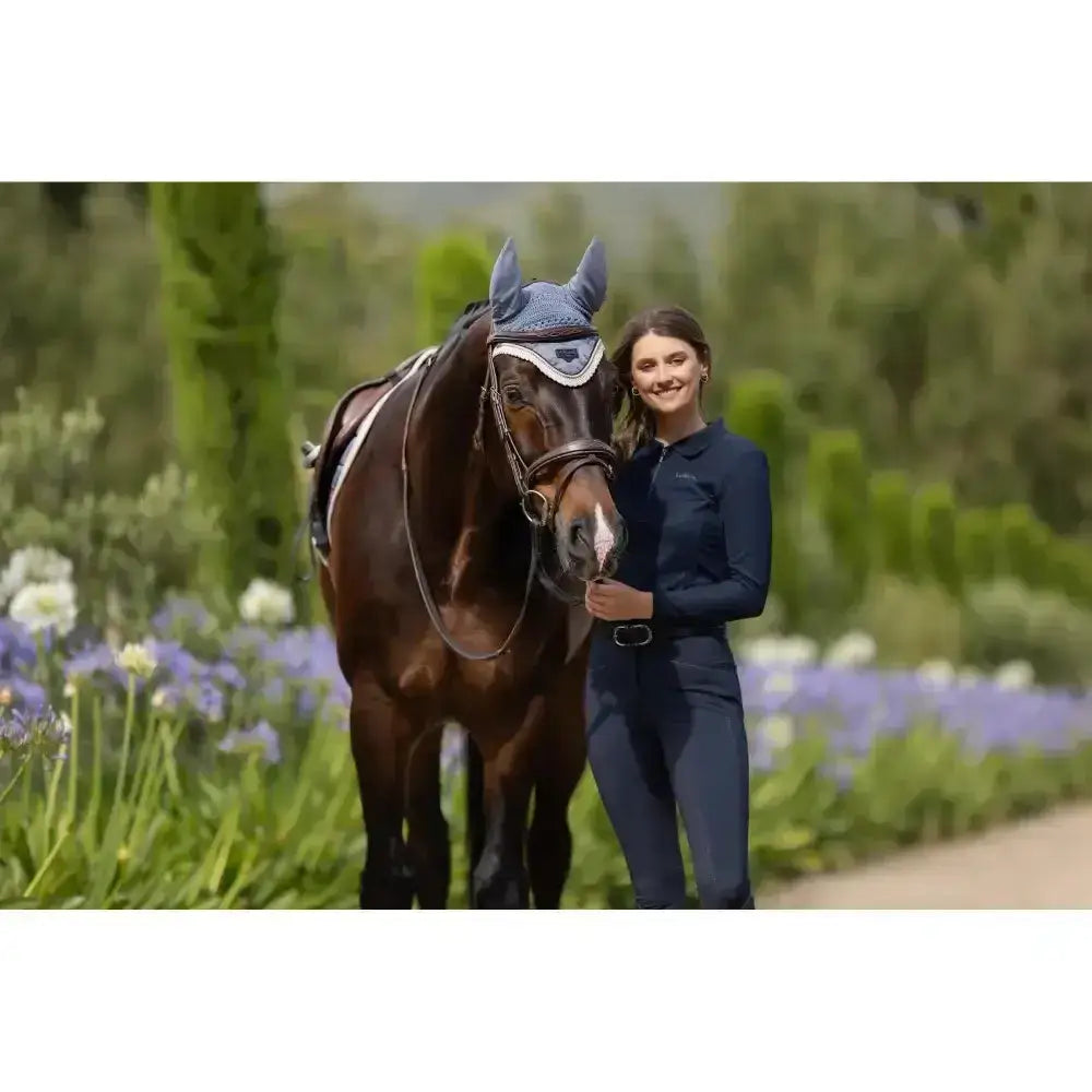 Blue patterned horse hood with silver trim paired with lemieux long sleeve navy sport polo shirt front view