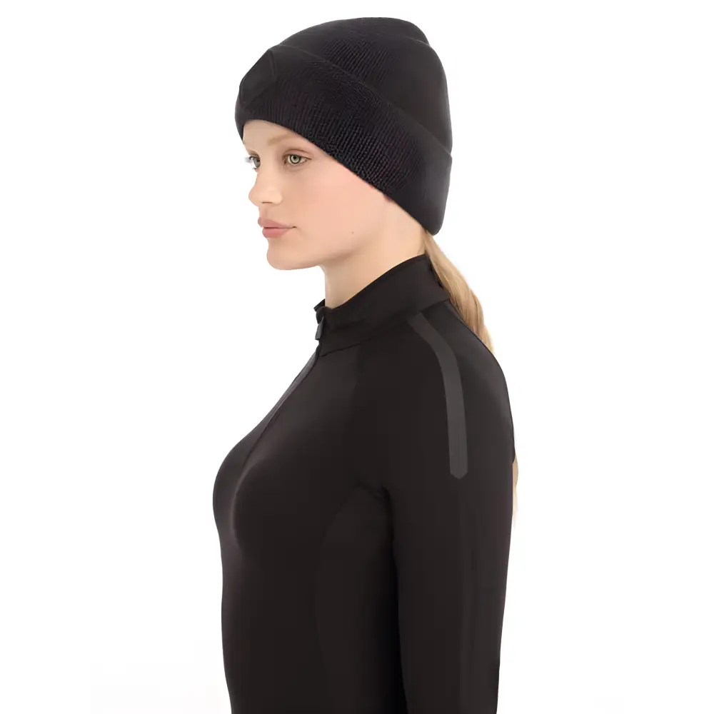 Person wearing Lemieux Lumen Beanie Black with a dark top for a stylish look