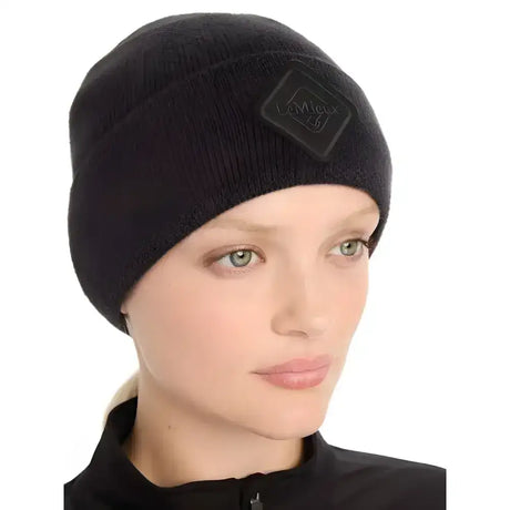 Black lemieux lumen beanie with reflective rib knit and micro-fleece lining featuring a subtle diamond logo patch