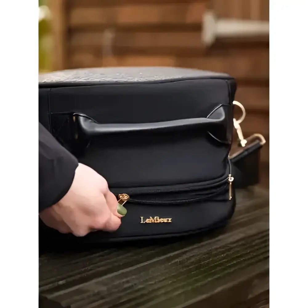 Black lemieux luxe hat box with sleek structured design and gold-tone zipper pulls perfect for stylish storage