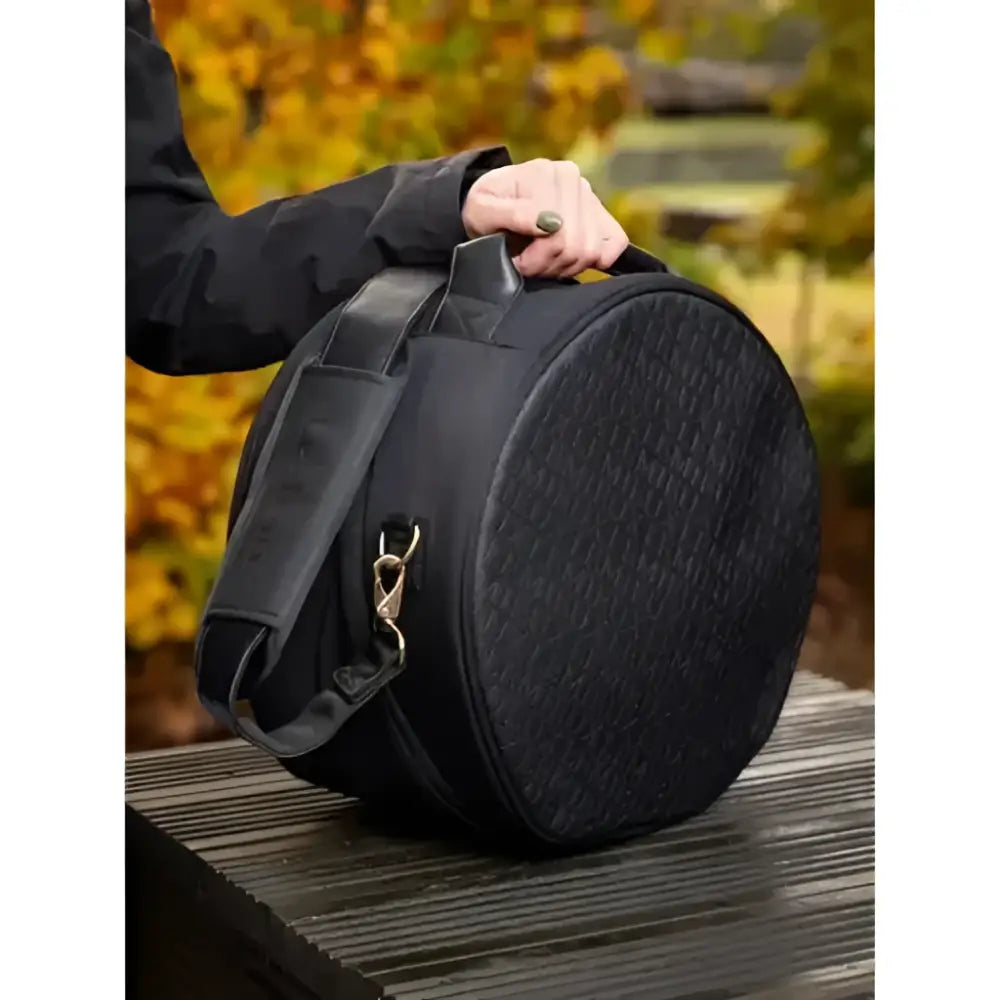 Black textured lemieux luxe hat box with adjustable shoulder strap and silver hardware for easy carrying