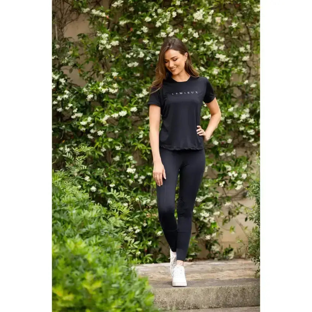 Black short-sleeved t-shirt with lomieux logo paired with lemieux lydia mesh legging navy for sporty style