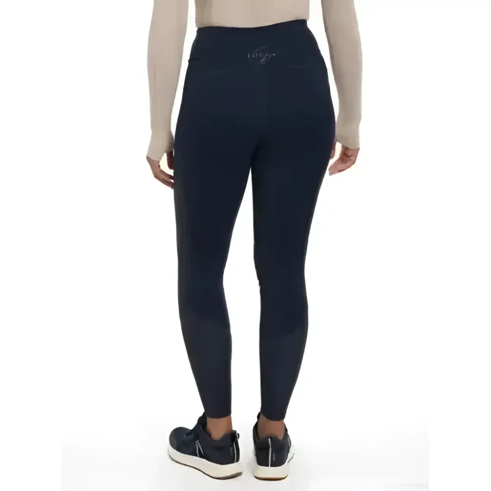 Back view of lemieux lydia mesh leggings in black high waisted style with subtle logo on the back waistband