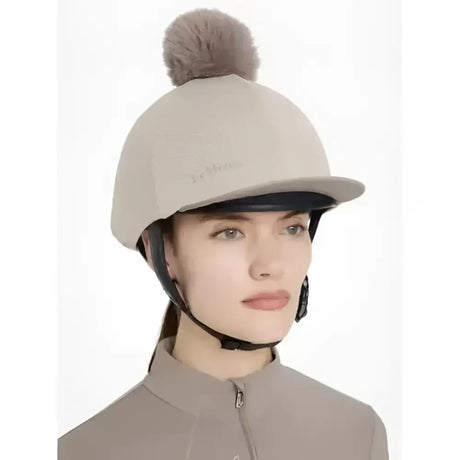 Beige lemieux maria mesh hat with soft fuzzy brown pom pom perfect for stylish equestrian looks