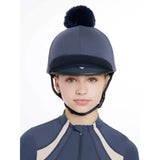 Navy blue lemieux maria mesh equestrian helmet with black faux fur pom pom in silk dusk blue finish