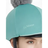 Teal lemieux maria mesh hat silk lagoon with gray faux fur pom-pom and white embroidered brand name