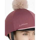 Maroon lemieux maria mesh hat with fluffy beige pom-pom made from silk rosewood fabric for equestrian use