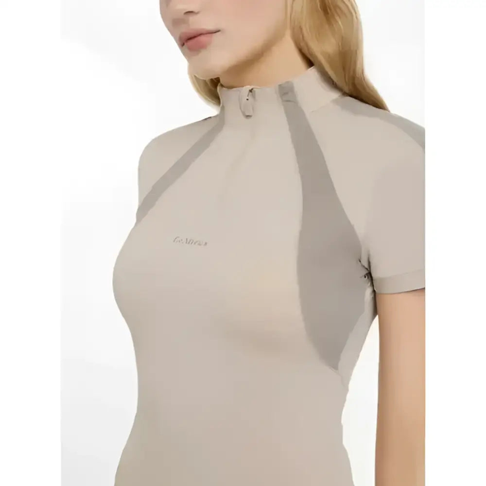 Beige and gray lemieux maria mesh short sleeve baselayer with high collar and zipper detail for athletic wear