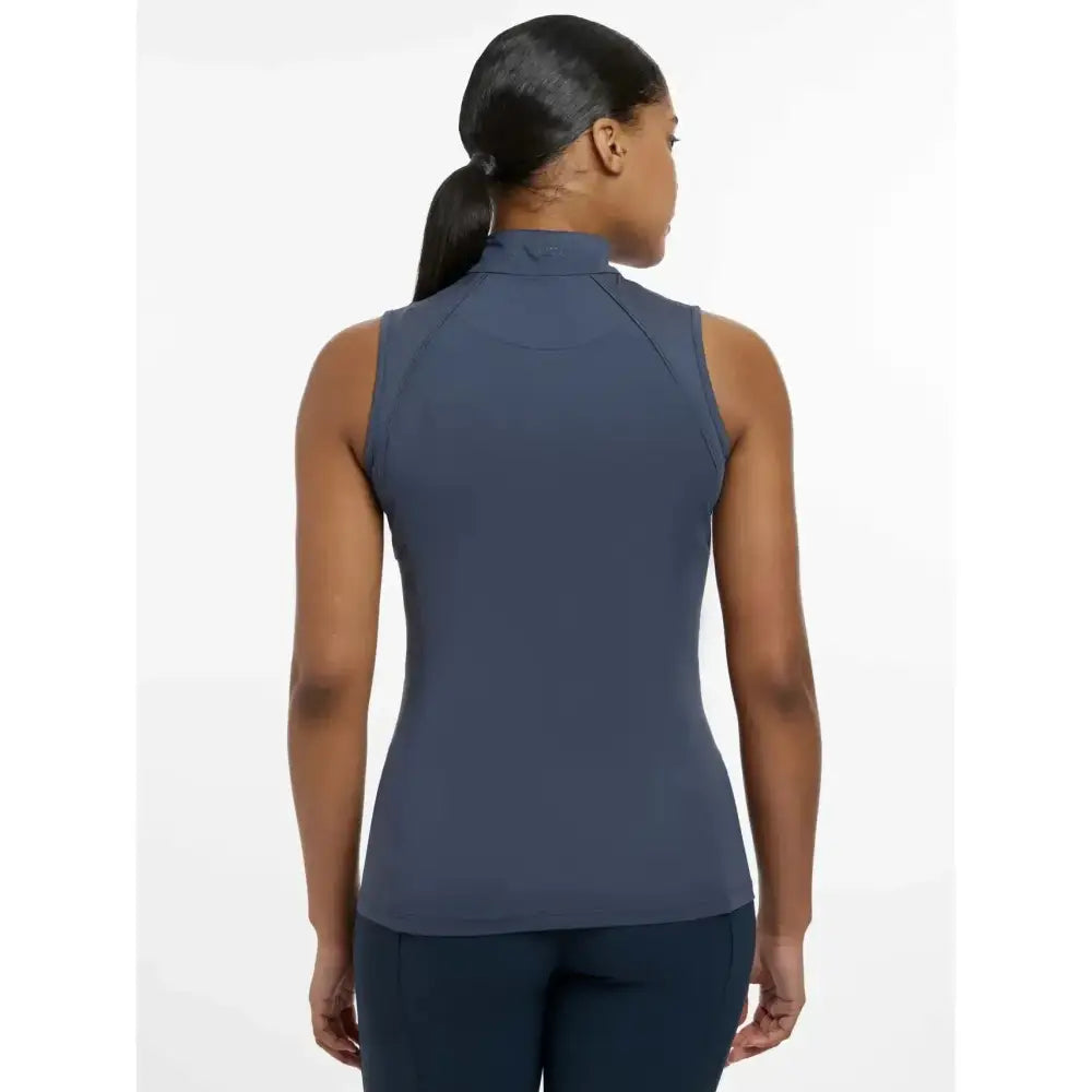 A sleek dark blue lemieux maria mesh sleeveless baselayer dusk blue with high collar and seamless design