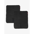 Black lemieux memory foam bandage pads with ribbed texture and red tags to keep your horses legs protected