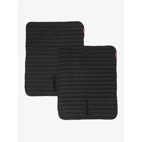 Black lemieux memory foam bandage pads with ribbed texture and red tags to keep your horses legs protected
