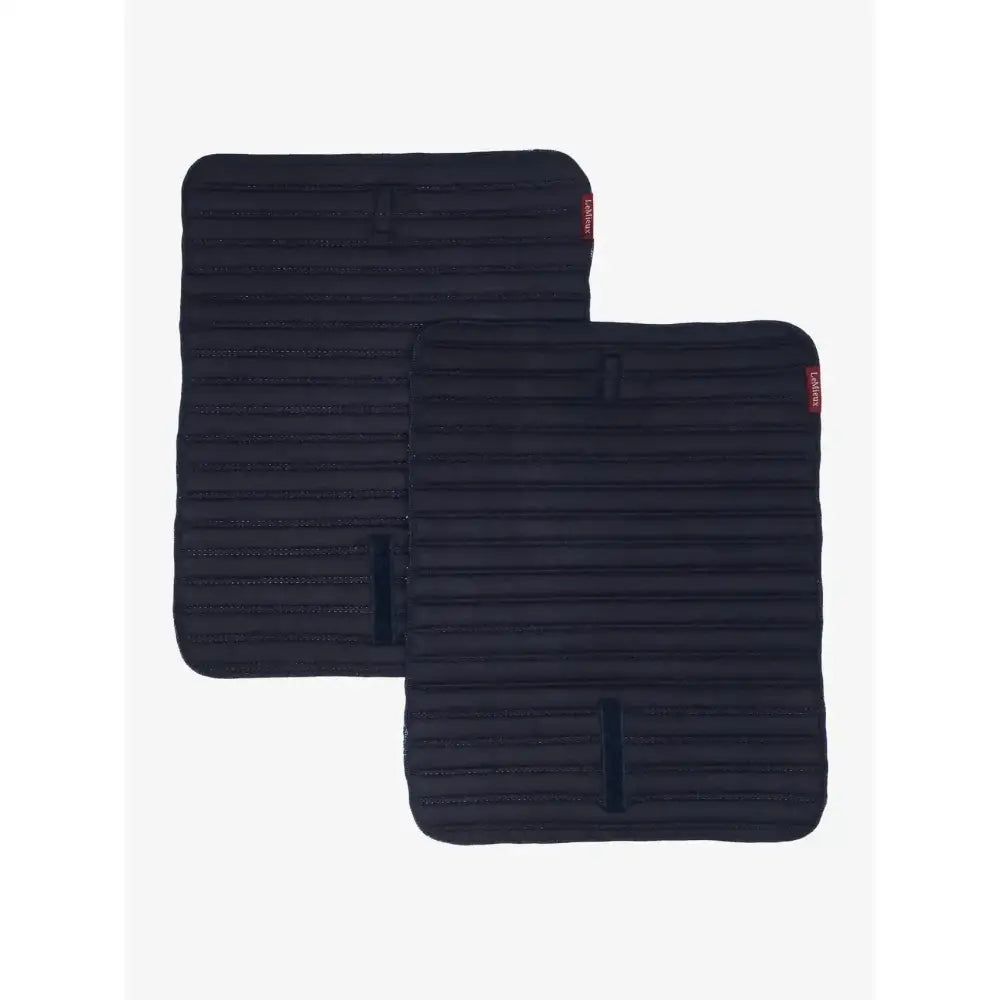 Black ribbed fabric car seat covers with small red brand tags paired with lemieux memory foam bandage pads navy protecting horse’s legs