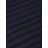 Black ribbed fabric with wavy texture on the back of lemieux memory foam bandage pads to keep horse’s legs protected