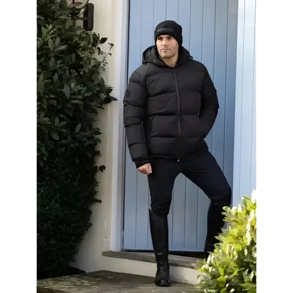 Black puffer jacket with hood and quilted design paired with lemieux mens beanie for cold weather style
