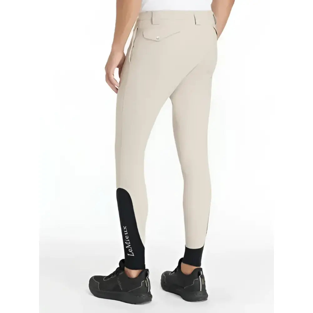 Beige lemieux mens classique breeches with black ankle panels and ladurée branding for stylish riding use