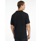 Lemieux mens classique polo shirt black with short sleeves, classic collar, and subtle logo on left sleeve