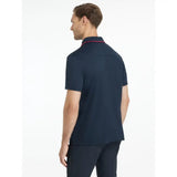Navy blue lemieux mens performance polo with short sleeves and pink trim on collar perfect for active wear